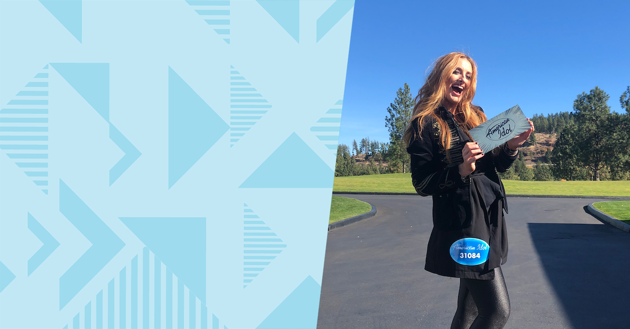 Capital One associate Caitlin standing with her American Idol card